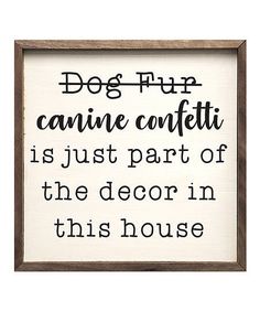 a framed sign that says dog flip canine confetti is just part of the decor in this house