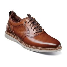 A hybrid mix of sneakers and dress shoes, the Stacy Adams sync plain toe elastic lace-up features a rich leather upper with micro-perfing details. The elastic lace system gives it slip-on convenience, while the red zone footbed adds all-day comfort.Features: Arch SupportClosure Type: Lace-UpShoe Heel Height: 1 InchUpper/Outer Base Material: 100% LeatherShoe Lining Material: TextileSole Material Content: 100% PolyurethaneToe Type: Plain Toe, Closed ToeCare: Spot CleanHeel Style: Flat HeelCountry Business Slip-on Oxfords With Perforated Toe Box, Slip-on Oxfords With Perforated Toe Box For Business, Slip-on Brogue Leather Low-top Shoes, Slip-on Low-top Leather Shoes With Brogue Detailing, Brown Leather Oxfords With Perforations, Synthetic Lace-up Shoes With Brogue Detailing, Brown Perforated Oxfords For Business, Business Brown Oxfords With Perforations, Business Dress Shoes With Perforations