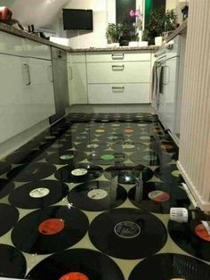 a kitchen with black and white polka dots on the floor