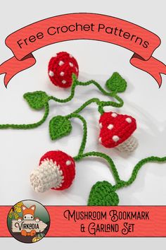 three crocheted mushrooms on a white plate with a red ribbon around the edges