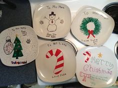 four plates with christmas designs on them