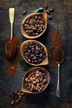 three bowls filled with coffee beans next to spoons and spices on top of a table