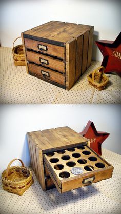 an old wooden box with holes in it sitting on top of a table next to a basket