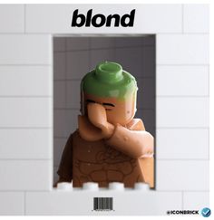 there is a lego man with a green hat in front of a white brick wall