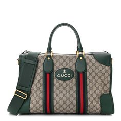 This is an authentic GUCCI Soft GG Supreme Monogram Web Medium Duffle Bag in Beige, New Acero and Green. This stylish travel bag is crafted with Gucci GG monogram coated canvas. It features green rolled leather top handles, an optional fabric shoulder strap, and green leather trim with the Gucci logo and skull motif in fold foil. This duffel has navy blue and red web fabric trim and brass hardware. The top zipper opens to a natural fabric interior with zipper and patch pockets.