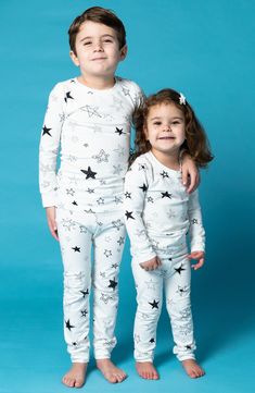 Sweet stars pattern these stretch-cotton pajamas with a longer-length top that means it won't ride up while baby is relaxing. This item is designed to fit snugly, as it is not flame-resistant 95% organic cotton, 5% spandex Machine wash, tumble dry Imported White Family Matching Sleepwear, White Family Matching Sleepwear For Pajama Party, Star Print Long Sleeve Sleepwear For Pajama Party, Star Print Long Sleeve Sleepwear For Loungewear, Long Sleeve Sleepwear With Star Print For Bedtime, Family Matching White Sleepwear For Loungewear, White Family Matching Tops For Loungewear, Long Sleeve Sleepwear With Star Print, Long Sleeve Star Print Sleepwear