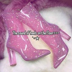 a pink high heeled shoe with stars on it