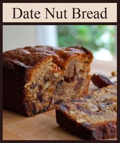 a sliced loaf of date nut bread sitting on top of a wooden cutting board