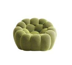 a green chair that is sitting on top of a white surface and it's made out of fabric