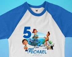 a white and blue baseball shirt with the number five on it, featuring characters from disney pixas