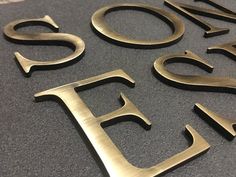 some metal letters that are on the floor