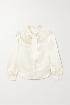 SAINT LAURENT's blouse is made from cream silk-charmeuse with a classic pussy-bow neck tie, which can be looped into a bow or worn loose. It's cut for a slightly loose fit with gently puffed sleeves and gathered cuffs. Layer yours under one of the brand's tailored blazers. Ysl Dresses, Build Wardrobe, Ysl Dress, Saint Laurent Collection, Cream Silk Blouse, Dressy Hats, Dior Top, Silk Chiffon Blouse, Formal Clothes