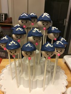 there are many cake pops in the shape of sailors hats on top of each other