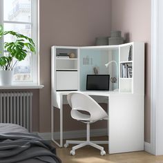 a white desk and chair in a room