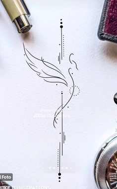 an ink drawing of a bird on paper next to fountain pens and other items,