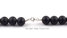 PRODUCT DETAIL :ITEM : MATTE BLACK ONYX BEADED NECKLACEITEM CODE :  DGC2355ITEM NAME :NECKLACEGEMSTONE : BLACK ONYXBEADS SHAPE : ROUNDLENGTH :   19 INCH APPROXBEADS SIZE:  12 MM  ApproxWEIGHT :  470 Cts. APPROXCUSTOMIZATION/BULK ORDER : AVAILABLEPLEASE FEEL FREE TO CONTACT IF YOU REQUIRE ANY FURTHER INFORMATION. Black Beaded Necklaces With Lobster Clasp, Black Beads Necklace, Halloween Beaded Jewelry, Round Bead Necklace, Tigers Eye Necklace, Black Onyx Necklace, Black Bead Necklace, Onyx Necklace, Necklace Beaded