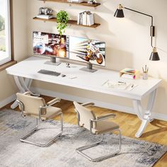 a white desk with two computer monitors on it