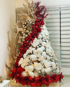 a christmas tree decorated with red and white ornaments