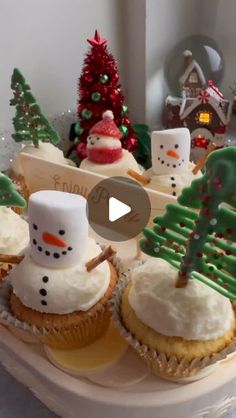 cupcakes decorated with frosting and christmas decorations