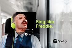 a man wearing headphones and listening to music on a train with the caption sing like freckie