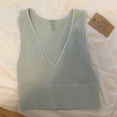 Exactly Like The One From Urban Outfitters. Super Soft. Never Worn. Still Has Tags. It’s One Size But Would Fit An Xs Or S. Seamless V-neck Beach Tops, Low-cut Seamless Tops For Loungewear, Summer V-neck Seamless Crop Top, Seamless V-neck Crop Top For Summer, Seamless Low-cut Tops For Loungewear, Seamless Crop Top For Spring Loungewear, Spring Low-cut Bra-friendly Top, Casual Stretch Low-cut Tank Top, Casual Low-cut Bra-friendly Tops