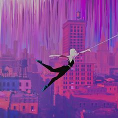 a woman flying through the air while holding onto a string in front of a city skyline