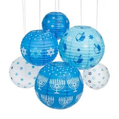 blue and white paper lanterns with menorah symbols hanging from the strings, on a white background