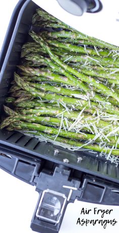 asparagus being cooked in an air fryer