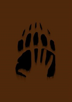 an animal's paw print on a brown background