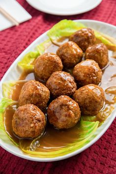 meatballs with sauce and lettuce on a plate