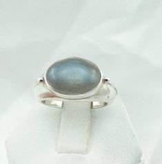 "Lovely vintage labradorite ring with an oval cabochon that flashes blue when tilted. A nice vintage ring for your collection. Stamped \"925\". Details: FREE SHIPPING! Sterling Silver (shown in picture) Labradorite: 14 mm x 10 mm Cabochon Gem Color: Green With Blue Flashes Ring Size: 8 Weight: 12.5 grams FREE Domestic Shipping by USPS Priority Mail Signature Confirmation and includes insurance. If the item is to be shipped internationally please contact us. International Shipping will be USPS Fi Moonstone Ring With Oval Labradorite, Collectible Oval Cabochon Moonstone Ring, Oval Silver Labradorite Jewelry, Vintage Oval Labradorite Jewelry, Bohemian Oval Labradorite Jewelry, Flash Ring, Handmade Silver Labradorite Crystal Ring, Oval Cabochon Labradorite Jewelry, Mail Signature