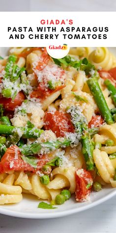 pasta with asparagus and cherry tomatoes in sauce on white plate text overlay