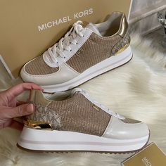 New In Box Michael Kors Women's Monique Trainer Shoes, Pale Gold, Size 7. Elevate Your Athleisure Style In The Micheal Micheal Kors Monique Trainer. Almond Toe. Lace-Up Closure. Fashion Hardware. Textile, Polyester Upper. Cotton Lining. Textile Insole. Rubber Outsole. Fashion Hardware, Athleisure Style, Trainer Shoes, Athleisure Fashion, Pale Gold, Michael Kors Shoes, Shoes Trainers, Athleisure, Almond