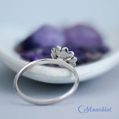 This nickel-free Sterling Silver ring features a dainty sunflower that measures 9 mm in width. The band is 1.5 mm wide and has been carefully curved for comfortable wear. This ring makes a wonderful addition to your stacking ring collection, a great pinkie ring, or a wonderful encouragement gift. The sunflower has many meanings across the world. Different cultures believe it means anything from positivity and strength to admiration and loyalty. In Chinese culture, sunflowers are said to mean goo Sunflower Design Rings As Gifts, Wedding Jewelry With Sunflower Design, Minimalist Flower Stackable Rings For Gift, Minimalist Flower Shaped Stackable Rings As Gift, Minimalist Flower Stackable Rings As Gift, Stackable Sterling Silver Flower Ring Gift, Sterling Silver Stackable Flower Ring As Gift, Dainty Stackable Flower Ring As Gift, Sunflower Design Flower Ring For Gift