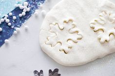 a cookie with icing on it sitting next to other decorations