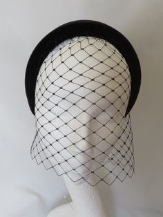 This listing is for a set of a headband and short black merry widow face veil. You will receive the veil and the headband as SEPARATE pieces, which can be worn together to create an elegant and stylish look. Headband - This is a beautiful simple and elegant plain black halo style headband. A thick padded style with luxurious black velvet covering. With black braid on the underside, it is a smaller sized fitting, so better for a smaller head and a sleek updo or straightened hair. (Smaller Velvet Adjustable Wedding Headband Costume Accessory, Vintage Black Fascinator For Costume Party, Vintage Black Headpieces For Costume Party, Black Fitted Headband For Wedding, Vintage Black Fascinator For Wedding, Elegant Black Costume Accessories For Wedding, Black Headband Mini Hat For Wedding, Black Headband Headpiece For Wedding, Vintage Black Costume Accessories For Wedding