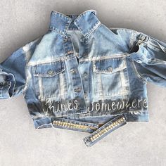 SHINES SOMEWHERE  Denim jacket.  Limited edition Super soft, lightweight and comfortable denim. ISHA CRUSH only uses the highest quality clothing and fabric paint for each piece. Each piece is: Designed with you in mind, in a unique style, thinking of passionate, independent women who want to express their voice. Light Wash Cotton Denim Top For Streetwear, Dark Wash Cotton Denim Top For Streetwear, Spring Streetwear Washed Denim Top, Medium Wash Denim Top For Streetwear, Blue Washed Denim Top For Streetwear, Trendy Acid Wash Cotton Denim Top, Trendy Bleached Denim Jacket, Trendy Denim Blue Jacket With Letter Print, Blue Denim Jacket With Letter Print