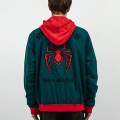 Miles Morales woven patch on the chest Embroidered patch on the back Embroidered text on the back Full front zip closure Snap side pockets Drawstring hood 100% Polyester Imported Officially licensed Marvel merchandise Aaron is wearing a medium