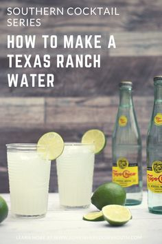 three bottles and two glasses with limes on the table