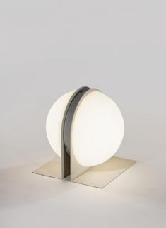 a white light sitting on top of a metal stand