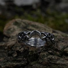 This vintage dark elvish engagement ring boasts a gothic design, complemented by a black stone. Crafted in sterling silver, it's not just a ring; it's a unique expression of love.  Characteristics: Metal - Recycled solid sterling silver  Stone - Cubic Zirconia - 1.75 mm 2 pcs Finish - Oxidized. View all silver fantasy rings: https://www.etsy.com/shop/TinyShinyJewel?ref=seller-platform-mcnav&section_id=45228149 Care instructions: To care for the ring, avoid contact with water and chemicals such as perfumes and lotions. When the ring is not in use, store it in a dry, cool place to prevent tarnishing. Additional information:  ✦ All rings are made to order. An average turnaround time is 1-5 days. I will make every effort to ship the ring sooner. ✦ FREE delivery.  ✦ Each piece is securely packa Fantasy Wedding Rings, Fantasy Ring, Unique Mens Rings, Unique Silver Rings, Gothic Design, Black Moon, Witchy Jewelry, Fantasy Wedding, Cute Rings