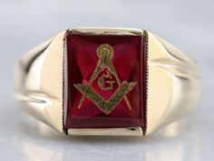 This vintage red ruby glass Masonic ring features polished, structurally simple shoulders, and a simple rectangular shape. The center is a classic red ruby glass cabochon, inlaid with the gold Masonic symbol, with a nice flat profile. Metal: 10K Yellow Gold Gem: Ruby Glass Gem Measurements: 12.0 x 10.1 mm, Rectangle Ring Size: 12.50 Marks: "10K" Stamped on the inside band Classic Red Intaglio Ring, Heirloom Red Signet Ring With Polished Finish, Luxury Rectangular Ruby Ring, Classic Red Signet Ring For Formal Occasions, Classic Red 14k Gold Signet Ring, Classic 14k Gold Red Signet Ring, Classic Red Intaglio Jewelry, Gold Ruby Signet Ring With Polished Finish, Heirloom Ruby Signet Ring With Polished Finish