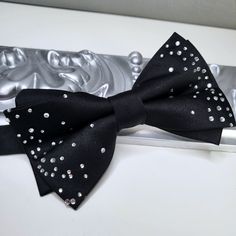 High-quality hand-made bow tie FREE US Domestic shipping Made with high-quality sateen fabric with crystal details Rare and Unique Pre-tied with an adjustable neck strap Measurement approx. 12cm x 6.5cm Come with box Perfect for wedding or any special occasion