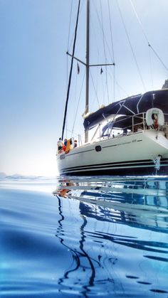 a sailboat floating on top of the ocean