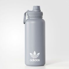 the adidas water bottle is grey and white