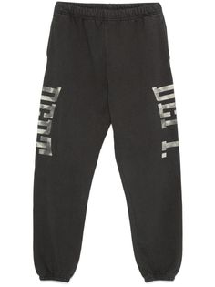 black cotton jersey texture faded effect elasticated waistband with internal drawstring two side inset pockets logo print to the side elasticated ankles tapered leg When buying this unisex item, keep in mind that it is graded in standard men's sizing. Gym Track, Activewear Print, Gallery Dept, Jogging Pants, Mens Activewear, Making Money, Tapered Legs, Logo Print, Track Pants