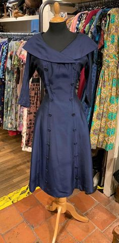 "Absolutely beautiful 50's dress in lovely vintage condition. Really chic, love this dress . No label, but professionally made .  This is a navy colour dress, rather darker than it appears in the photos. Bust 32\"  Waist 26\"  Waist to hem 28\"  (These are the actual dress measurements, so the best way to check sizing is by comparing these measurements with those you can check on a dress you already own, that you know fits you well) Please note, something to be aware of, that the colour you see in the photos depends on your own phone or screen.  I try to list the dresses with photos that are representative, but occasionally I've seen on other people's devices that the colour can look a bit different... Whenever possible I wash and press dresses before storage, so they are clean (but may ne Vintage Dresses Online, Fab Dress, Navy Colour, Blue Fits, 50s Dresses, Mod Dress, Wiggle Dress, Dress Measurements, Online Shops