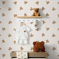 a teddy bear sitting on top of a wooden shelf next to a baby crib