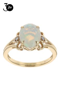 1.37ct Oval Ethiopian Opal With 0.02ctw Round White Diamond 10k Yellow Gold Ring. Measures Approximately 0.46"L x 0.39"W. Oval Opal Engagement Ring, Opal Engagement Ring, Opal Engagement, Engagement Rings Opal, Yellow Gold Ring, 10k Gold, Yellow Gold Rings, Ethiopian Opal, White Diamond