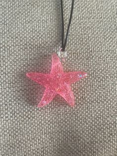 "This gorgeous resin starfish pendant is absolutely stunning. It is a small-medium sized pendant. It is strung beautifully along a black cord with adjustable rings to be between 20-22\" in length and is finished with a lobster clasp.  This can be placed on 18-20\" length if requested.  This is an absolutely gorgeous pendant and would be a great birthday present, anniversary present, Mother's Day gift, Valentine's Day present, birthday present, or graduation gift. The sleek design of this pendant will turn heads and make you take a second look! Like what you see? View more at: https://www.etsy.com/shop/StephsCraftingBits" Pink Starfish Jewelry For Gift, Star-shaped Resin Jewelry For Gifts, Star Shaped Resin Jewelry Gift, Adjustable Necklace With Starfish Charm As Gift, Adjustable Starfish Charm Necklace As Gift, Adjustable Starfish Charm Necklace For Gift, Beach Theme Jewelry, Beachy Jewelry, Jewelry Gift Ideas